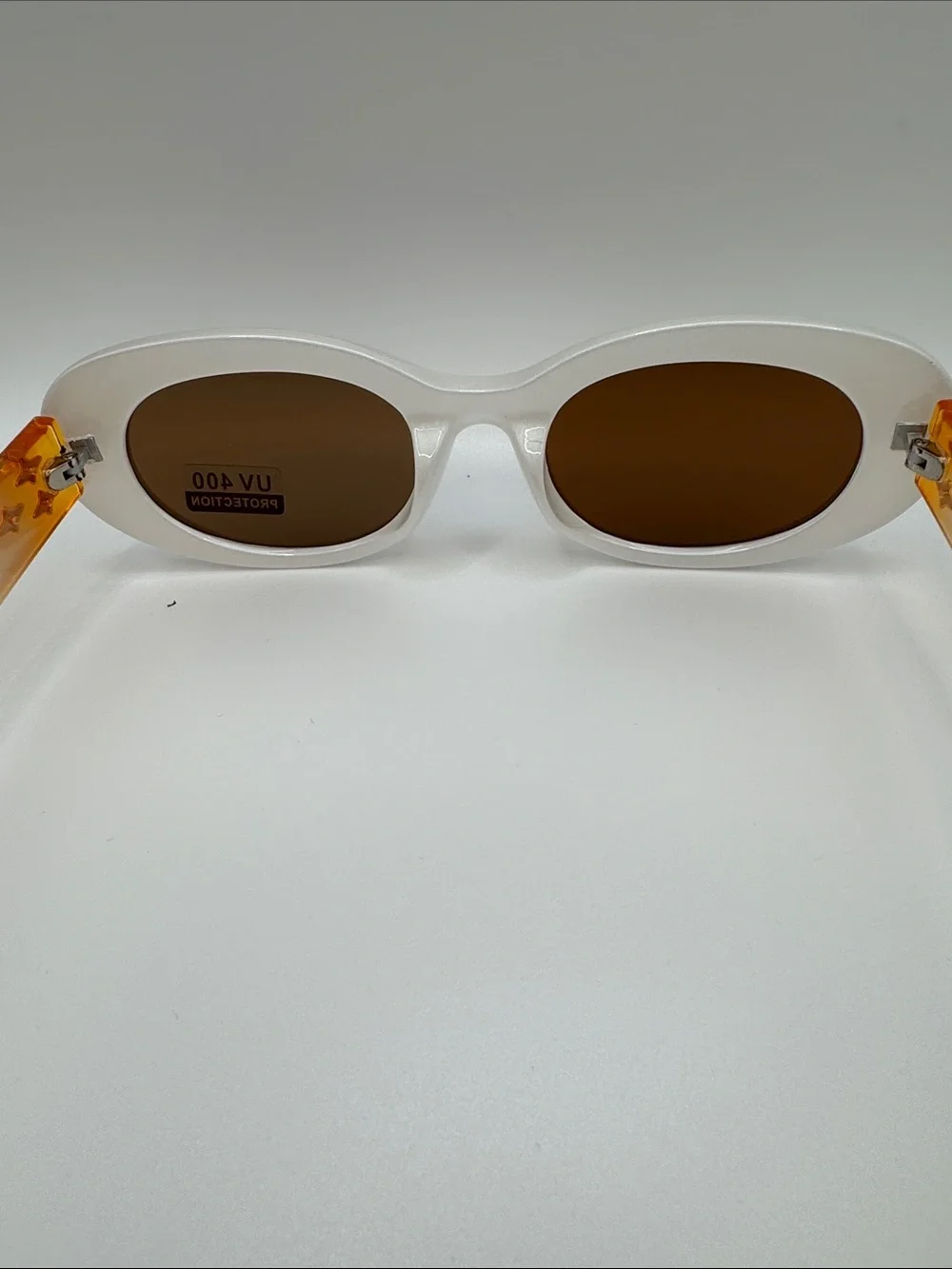 White Oval Sunglasses with Brown Lenses